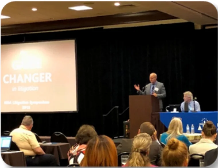 Brian Beck speaking at a legal event